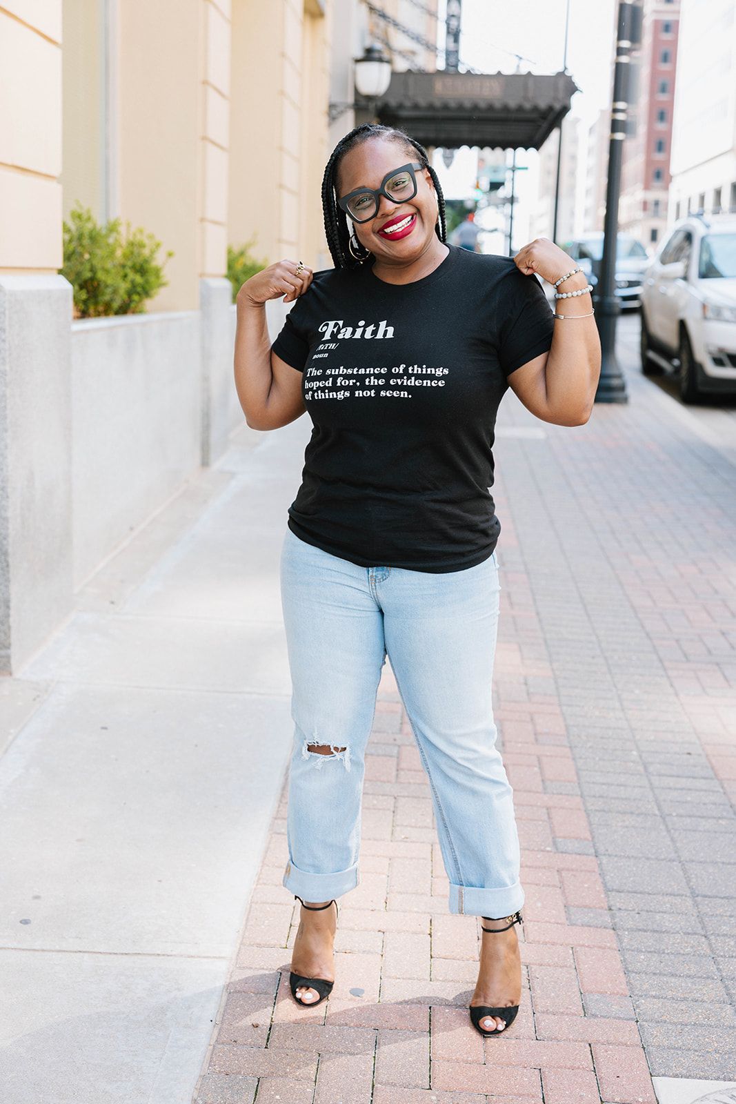 Dr. Dana Gathers, Ph.D., smiling outdoors in a Just Write Faith t-shirt